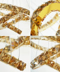 Close-up of Dope Crystal Ring LED Pendant Light With Adjustable Stainless Steel Ceiling Fixture highlighting crystal rings.