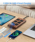 Slick Wood Finish Surge Protector Power Strip With Six Widely Spaced Outlets And Dual USB C Plus Dual USB A Ports on desk.