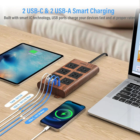 Slick Wood Finish Surge Protector Power Strip With Six Widely Spaced Outlets And Dual USB C Plus Dual USB A Ports on desk.