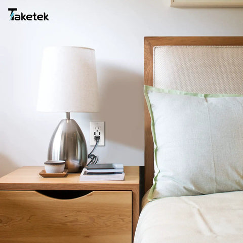 Bedroom scene with USB Wall Outlet With Turbo Fast Charging USB Ports, 15 Amp Tamper Resistant Receptacle near a lamp.