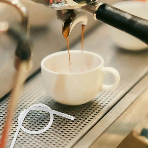 Espresso machine pouring into cup with Six Pack Milk Frother Hose Replacement Kit With Three Connectors beside it.