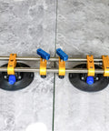 Two-piece 6-inch stone seam setter with vacuum suction cups, blue handles and yellow clamps for countertop installation
