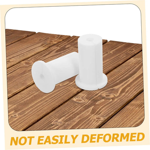Premium Silicone Antenna Protectors And Wall Hole Plugs For Seamless Drywall Cable Routing. White silicone wall hole plugs on wood surface, not easily deformed.