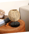 Khaki Rattan Pendant Lamp Shade With Hollow Basket Design on side table, natural rattan texture, fits various room decors