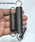 Heavy Duty 2 Pc Tension Springs With Open Hooks Pullback Force Wire Spring For Mechanical Repairs durable steel springs in hand.