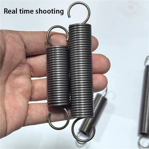 Heavy Duty 2 Pc Tension Springs With Open Hooks Pullback Force Wire Spring For Mechanical Repairs durable steel springs in hand.