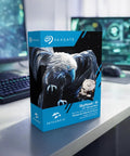 SkyHawk AI 8TB Video Internal Hard Drive box on desk in front of computer, 3.5 Inch SATA 6Gbps, 256MB Cache, for DVR NVR systems
