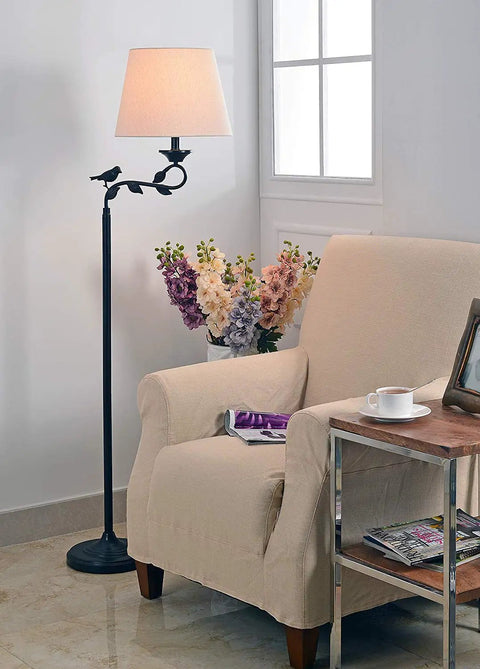 Birdsong Swing Arm Floor Lamp With Oil Rubbed Bronze And Gold Highlights Finish Rustic Style Standing Light With White Tapered Shade 3 Way Lighting For Cozy Ambient Vibes In Living Room Or Bedroom beside armchair