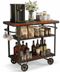 Smooth Rolling Three Tier Vintage Bar Cart On Wheels With Heavy Duty Metal And Wood Frame For Kitchen Home Office Or Weekend Hangout Setup Built Rock Solid With Dual Side Handles, featuring drinks and coffee maker.