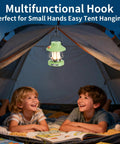 Two kids in a tent with Kid Friendly Lantern With Three Color Modes And USB C Charging hung above them.