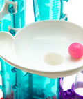 Thames and Kosmos Gumball Machine Maker toy, close-up view; pink gumball in white dish with teal frame