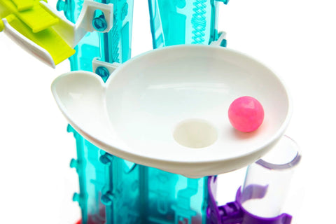 Thames and Kosmos Gumball Machine Maker toy, close-up view; pink gumball in white dish with teal frame