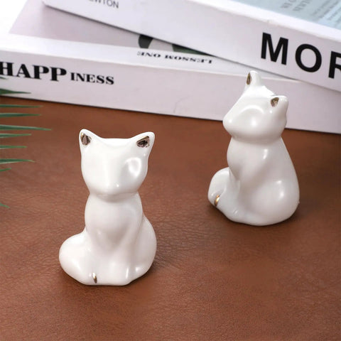 Cute white ceramic cat figurines for bathroom decor, enhancing style in Level Up Your Bathroom Vibe With This Dope Set Of Ceramic Cat Toilet Bolt Covers And Floor Screw Caps Rust Proof Maximalist Accent For Hiding Ugly Base Screws Forever.