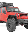 Red Jeep Wrangler JK 2007-2018 with front bumper caps for rock crawler stubby conversion, equipped with nylon caps.