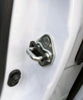 Close-up of heavy duty door striker sound damper bushing for Honda CRV Civic Accord mounted to car door.