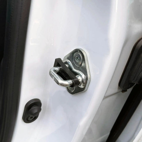 Close-up of heavy duty door striker sound damper bushing for Honda CRV Civic Accord mounted to car door.