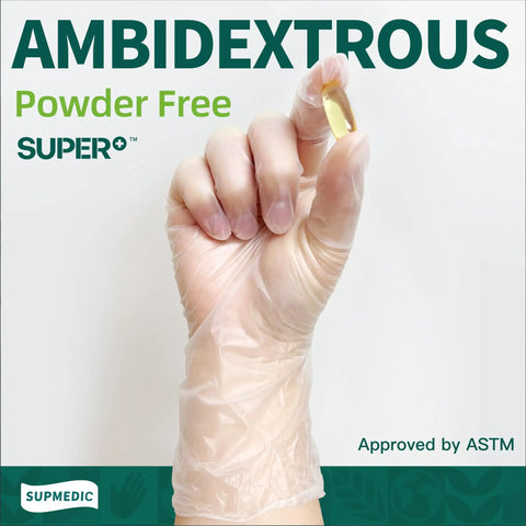 Hand wearing vinyl disposable exam glove holding capsule, clear 4 mil, powder free, latex free, medical, food safe, 100 pcs, small size.