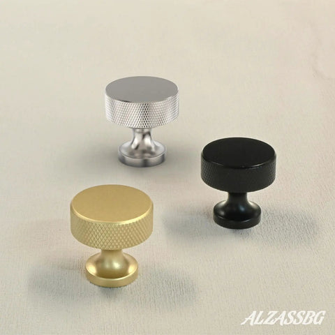 Three assorted cabinet knobs in brushed satin nickel, black, and gold, showcasing 10 Pack Brushed Satin Nickel Cabinet Knobs For Cupboards And Drawers, 1 And One Quarter Inch Diameter Knurled Round Hardware, Solid Feel, Easy Install, Ideal Kitchen Cabinets And Furniture Upgrade AL6066SN.