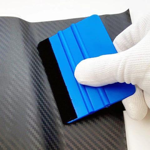 DIY Car Wrap Tools Kit With Gloves, 4 Inch Felt Squeegee in use on black carbon fiber vinyl