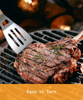 4 Piece Stainless Steel BBQ Grill Utensil Set With Wood Handles, Slotted Turner flipping steak on grill, outdoor barbecue scene
