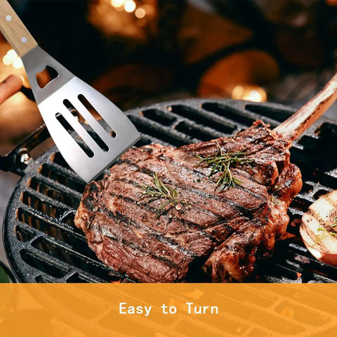 4 Piece Stainless Steel BBQ Grill Utensil Set With Wood Handles, Slotted Turner flipping steak on grill, outdoor barbecue scene