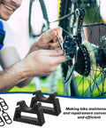 Man tuning bike drivetrain with Rugged Bike Repair Stand With Handlebar Stabilizer For Mountain And Road Bikes tools visible