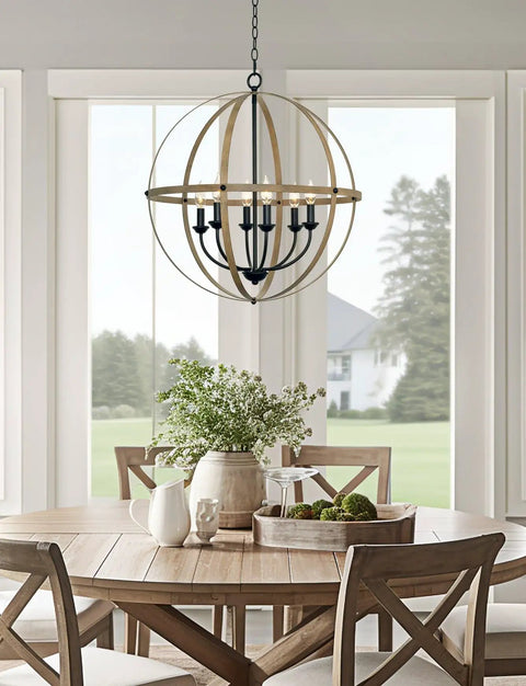 Harmon 27 Inch Six Light Dope Modern Farmhouse Armillary Chandelier With Sphere Globe Design In Smoked Birch Finish hanging over dining table