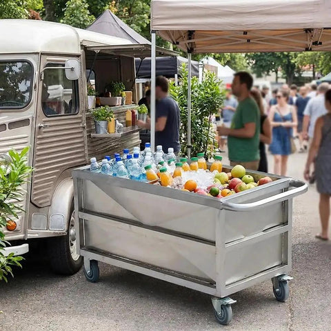 Heavy Duty Commercial Food Prep Cart With Slick Rolling Locking Casters Featuring Deep 304 Stainless Steel Soak Tank For No Sweat Busy Kitchen Grind Ready Setup filled with drinks and fruits at a busy market.