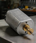 Heavy Duty 7500 Rpm Electric Motor For M5 And P800 Hair Trimmers 5V High Speed metal motor on a workbench.