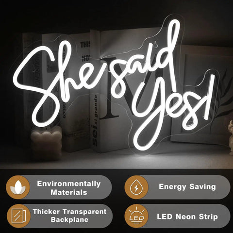 She Said Yes Neon Sign Led Light For Weddings And Parties White 60cm on acrylic backplate, glowing in dim setting