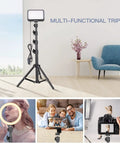 Two Pack LED Video Light Kit With Adjustable Tripod Stands, Dimmable Lighting, setup in modern room with plush chair and window view.