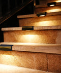 Outdoor Solar Deck Lights Set Of 6 Dope 7 Color RGB Waterproof Step Lights illuminating outdoor stairs with warm glow