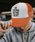 Dope Lightweight Distressed Trucker Cap With Front Graphic Artwork Cotton Baseball Hat For Men And Women Casual Everyday Vibe In Multiple Colorways Go To Wardrobe Staple, orange cap with text 'No Crying On The Yacht'