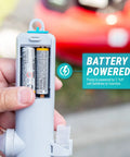 Close-up of All American Style Battery Powered Stick Pump showing battery compartment powered by 2 AA batteries for fluid transfer.