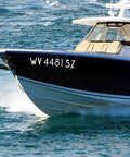 3 Inch White Self Adhesive Vinyl Letters And Numbers Kit displayed on boat identification WV 4481 SZ on water