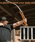 Archer using Bow String Silencers for Longbow and Recurve 2 Pairs Self Adhesive Limb Protectors, outdoors.