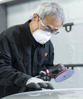 Person using Cubitron II Hookit Clean Sanding Abrasive Disc 31465 For Automotive Sanding 3 Inch 500 Plus Grit on car surface