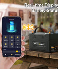 Image showing a person using Bluetooth app to monitor a 12V 100Ah LiFePO4 Battery With Bluetooth BMS IP67 Waterproof For RV Solar Marine.