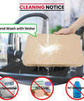 Hand washing a 15 By 12 Inch Pizza Stone For Oven And Grill Cordierite Rectangular Baking Stone under running water in a sink.