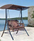 Outdoor swing bench with canopy by the lake.