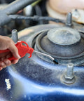 Air Blow Gun With Four Inch Nozzle For Air Compressors And Dust Cleanup Ergonomic Grip Tilting Nozzle in use on car engine