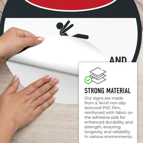 Hands peeling adhesive side of Warning Floor Decal For Machinery Areas Danger Exposed Conveyors And Moving Parts Can Cause Severe Injury