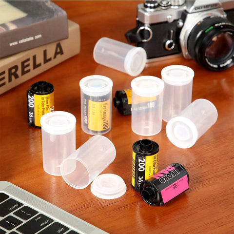 Clear 35mm Plastic Film Canister Set Of 20 With Lids For Storage And Organization Durable PP Jars with film rolls on a table