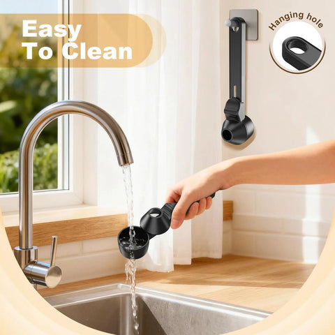 Mess Free Two Tablespoon Coffee Scoop With Built In Funnel For Reusable K Cup Pods being rinsed under a tap with hanging hole.
