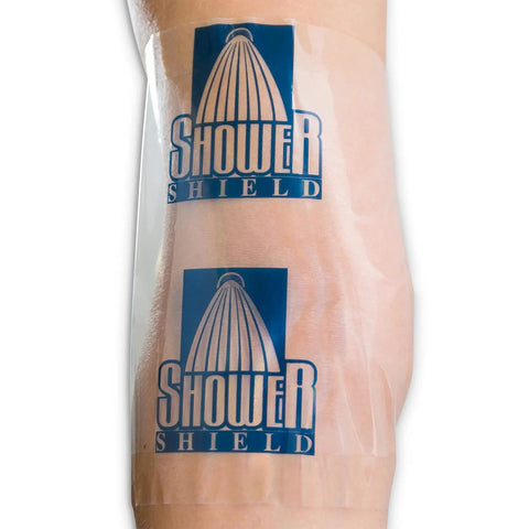 Person wearing Catheter Shower Cover 7x7 Inch, Waterproof Disposable Shield For PICC Lines And Dialysis Ports, Clear Transparent on arm.