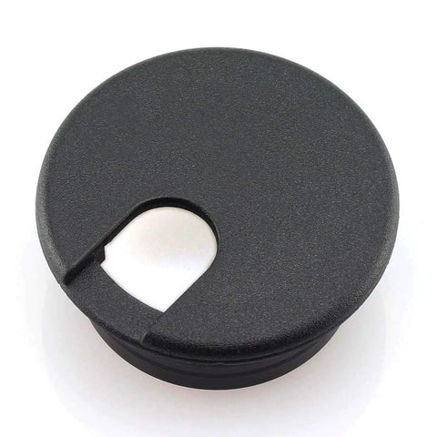 Top view of a black plastic 2 Pack 1-1/2 Inch Desk Wire Grommets Hole Covers Black Plastic Cord Organizer For Office PC Desk Cable Management and Neat Wires Keeps Cables Hidden and Tidy.