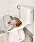 Two Pieces Rabbit Shaped Ceramic Toilet Bolt Covers Set For Bathroom Decor installed on white toilet, close-up view.