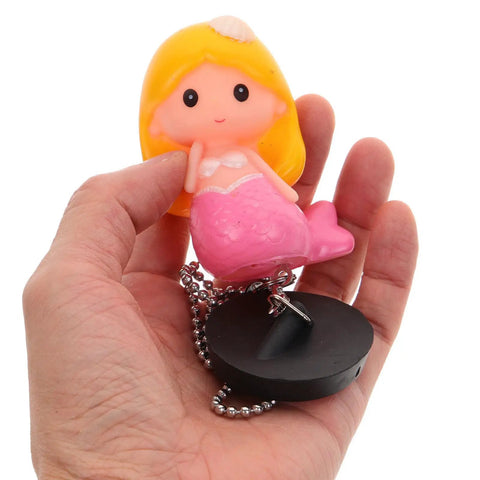 Mermaid Bathtub Stopper Rubber Plug with Chain for Easy Drain in hand, featuring pink tail and chain for easy removal.