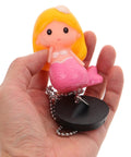 Mermaid Rubber Tub Stopper with Chain for Bathtub Drains held in hand, featuring colorful mermaid design and black rubber base.