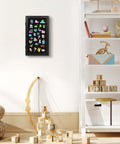 Compact Wall Mounted Pin Display Case Black 15 By 8.5 Inch showcasing colorful enamel badges against a clean wall.